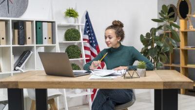 medium shot girl studying desk indoors 1